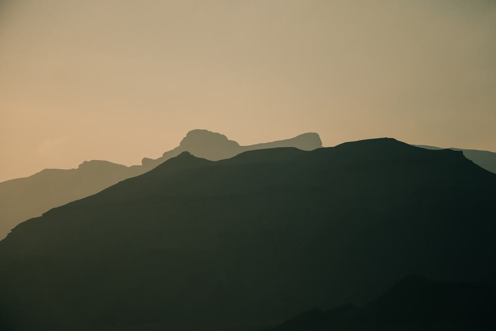 Peaceful coastal and mountain landscape featuring subdued colors suitable for backgrounds and travel articles