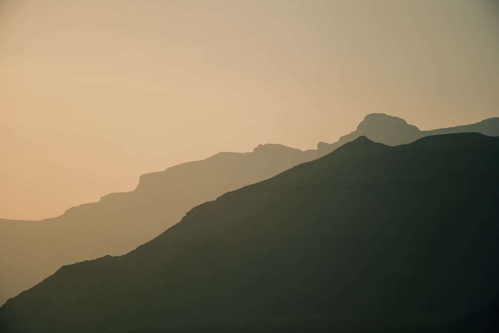 Soothing panoramic landscape featuring soft shades and distant ridgelines ideal for visual branding