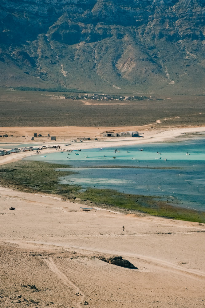 Serene aquatic scene. Calm turquoise waters with sandbars and mountain backdrop for research