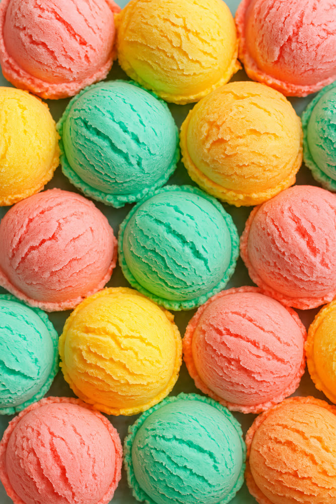 Brightly colored ice cream servings displayed in neat symmetrical layout highlighting diverse flavors