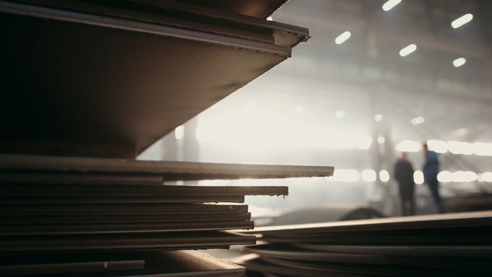 Sunlit warehouse with dust motes. Industrial space illuminated with dust and architectural haze